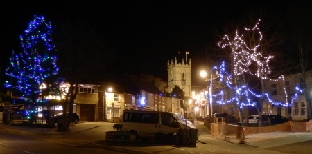 Church floodlit and Christmas lights